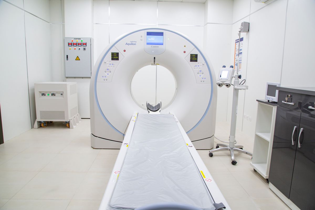 CT scanner setup in a sterile hospital room