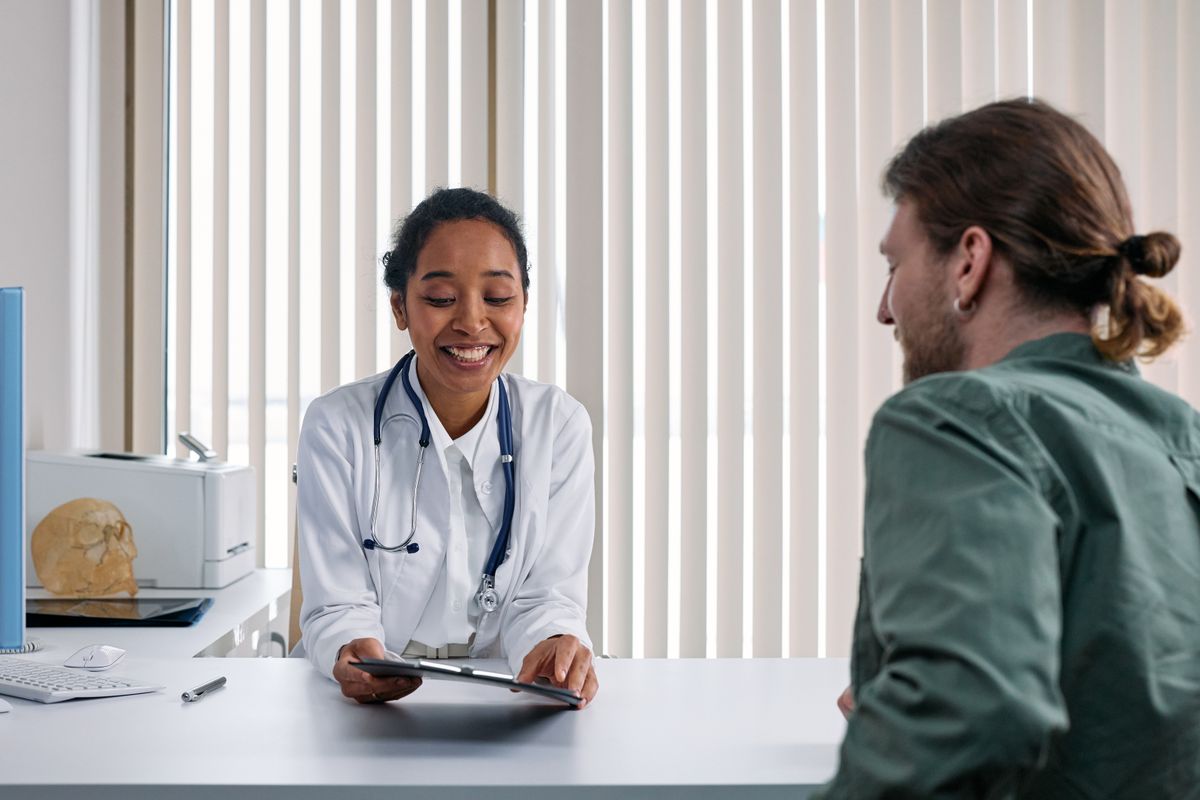Doctor and patient engaged in a consultation in a bright clinic setting