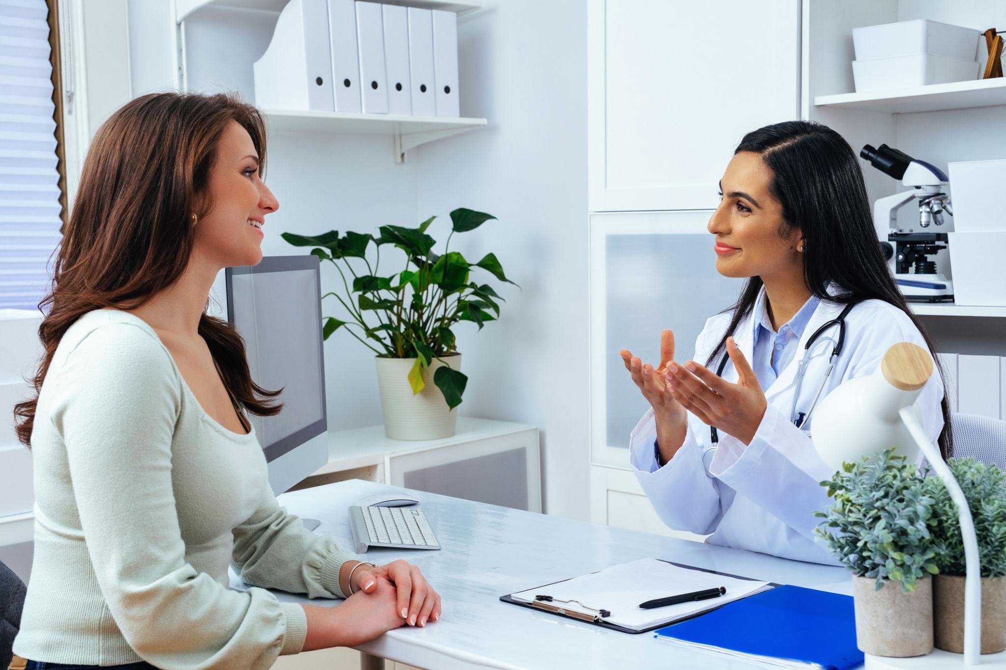 Female physician consulting with a patient in a modern medical office