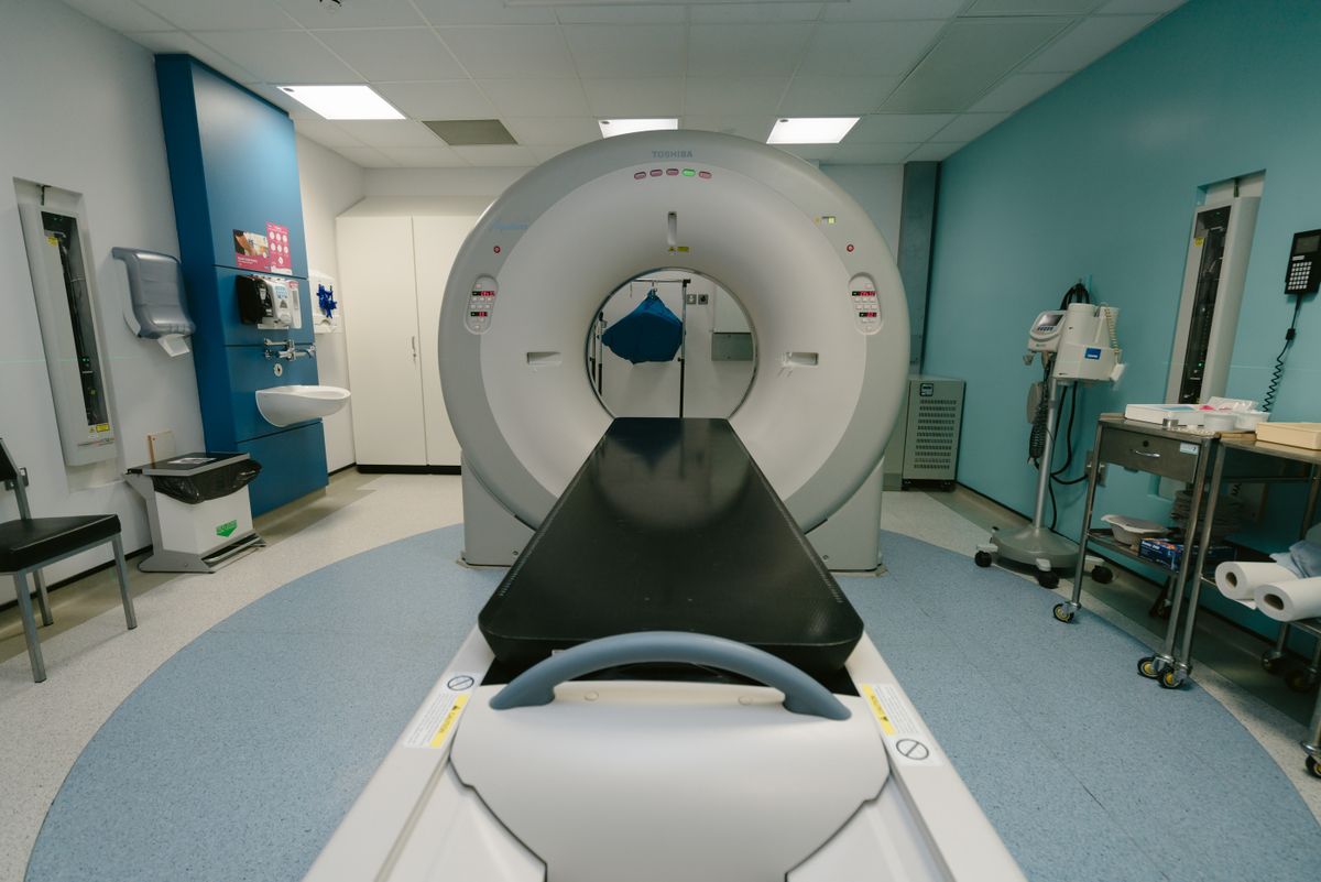 High-tech MRI machine in a spacious hospital examination room