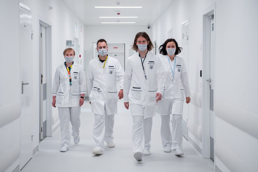 Medical team walking through a hospital corridor