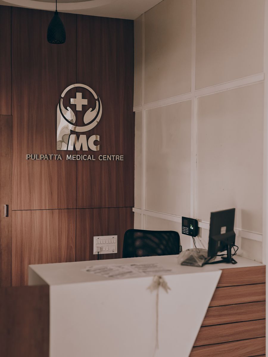 Warm, contemporary reception desk with wood panel accents